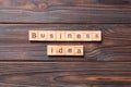 Business idea word written on wood block. business idea text on cement table for your desing, concept Royalty Free Stock Photo