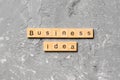 Business idea word written on wood block. business idea text on cement table for your desing, concept Royalty Free Stock Photo