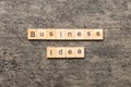 business idea word written on wood block. business idea text on cement table for your desing, concept Royalty Free Stock Photo