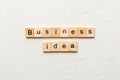 business idea word written on wood block. business idea text on cement table for your desing, concept Royalty Free Stock Photo