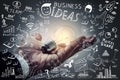 Business ideas.Light bulb on hand with freehand drawing business Royalty Free Stock Photo