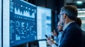 Business Intelligence Team Analyzing Data on Wall Screens Royalty Free Stock Photo