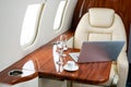 Business Jet airplane interior with laptop Royalty Free Stock Photo