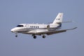 Business Jet landing in the afternoon sun