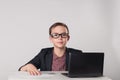 Business kid sitting in front of laptop Royalty Free Stock Photo