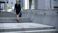 Business lady climbing stairs to office center, career ladder, success promotion