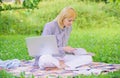 Business lady freelance work outdoors. Woman with laptop sit on rug grass meadow. Steps to start freelance business Royalty Free Stock Photo