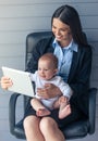 Business lady with her baby Royalty Free Stock Photo