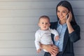 Business lady with her baby Royalty Free Stock Photo