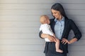 Business lady with her baby Royalty Free Stock Photo