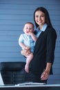 Business lady with her baby Royalty Free Stock Photo