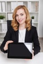 Business lady holding large tablet Royalty Free Stock Photo