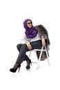 Beautiful arab woman posing in stylish office attire isolated on studio background. Fashion concept