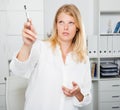 Business lady pointing out by pen Royalty Free Stock Photo