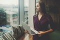 Businesswoman with laptop next to office window Royalty Free Stock Photo