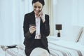 Business Lady Speaks Phone and Holds Credit Card Royalty Free Stock Photo