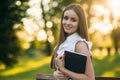 Business lady uses a tablet in the park during a break