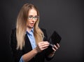 Business lady wearing blue glasses checking wallet