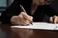 Close-up human hands view of businesswoman signing documents. Generative AI