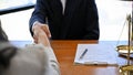 A business lawyer in the meeting with his client in the office of a law firm. close-up image Royalty Free Stock Photo