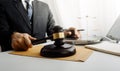 Business and lawyers discussing contract papers with brass scale on desk in office. Law, legal services, advice, justice and law c Royalty Free Stock Photo