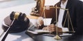 Business and lawyers discussing contract papers with brass scale on desk in office. Law, legal services, advice, justice and law Royalty Free Stock Photo