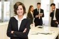 Business leader looking at camera in working environment Royalty Free Stock Photo