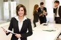 Business leader looking at camera in working environment Royalty Free Stock Photo