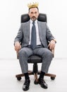 business leader man in crown. big boss. business success and leadership. successful businessman leader in chair Royalty Free Stock Photo