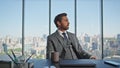 Business leader pondering solution at city view. Successful banker resting chair Royalty Free Stock Photo