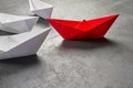 Business leadership Concept, Paper Boat, the key opinion Leader, the concept of influence. One red paper boat as the Leader, Royalty Free Stock Photo