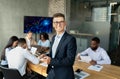 Business Leadership. Portrait Of Young Businessman With Digital Tablet Posing In Office