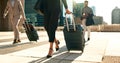 Business, legs and luggage for travel in city with corporate people walking to hotel, airport or business opportunity Royalty Free Stock Photo