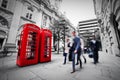 Business life concept in London, the UK. Red phone booth Royalty Free Stock Photo