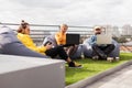 Business lifestyle in the roof garden, creative space. Bean bag chair in office