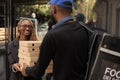 Business lunch delivery, cheerful client holding pizza boxes pile Royalty Free Stock Photo