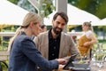 Business lunch for two managers, discussing new business project. Couple sitting outdoors on terrace restaurant, having Royalty Free Stock Photo