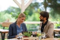 Business lunch for two managers, discussing new business project. Couple sitting outdoors on terrace restaurant, having Royalty Free Stock Photo