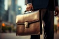 Business magnate gripping classic briefcase, a symbol of corporate prowess