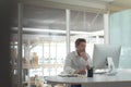 Business male executive working on computer at desk in a modern office Royalty Free Stock Photo