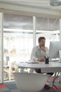 Business male executive working on computer at desk in a modern office Royalty Free Stock Photo