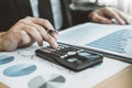 Business man Accounting Calculating Cost Economic budget putting Row and coin Write Finance ,investment and saving concept Royalty Free Stock Photo