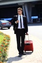 Business man at airport with suitcase Royalty Free Stock Photo