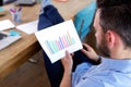 Business man analyzing growing charts at his desk Royalty Free Stock Photo