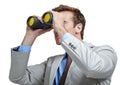 Business man, binoculars and spy to search for opportunity, future vision and monitor isolated on a white studio Royalty Free Stock Photo