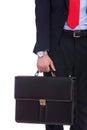 Business man in black suit hand holding briefcase Royalty Free Stock Photo