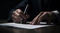 Business man in black suit signing contract document with digital tablet on office desk, deal concept, close up Royalty Free Stock Photo