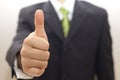 Business man in black suit with thumbs up Royalty Free Stock Photo