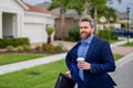 Business man with briefcase and take away coffee run outdoor. Businessman run down street, late meeting. Running Royalty Free Stock Photo