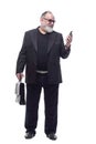 business man with a briefcase is talking on a mobile phone . Royalty Free Stock Photo